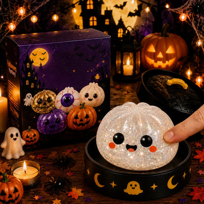 White glitter smiling ghost squishy pressed on a moon stand, slow-rising Halloween stress ball
